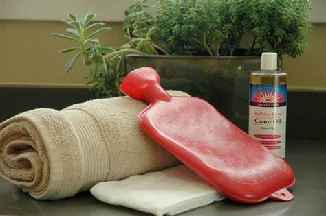 Step by step process of making castor oil pack at home with organic castor oil. flannel cloth and heating pad